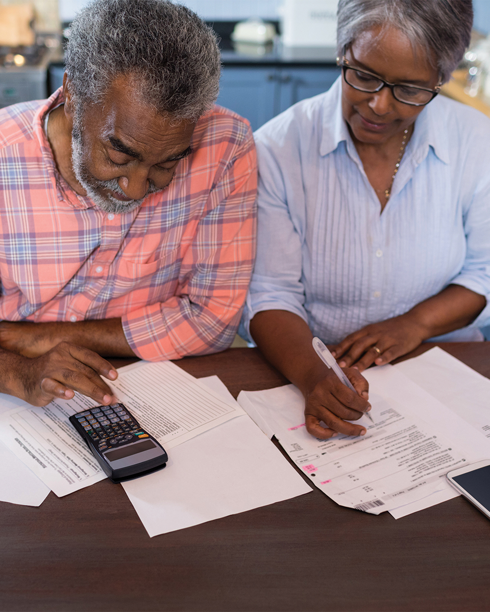 older couple working on their budget together