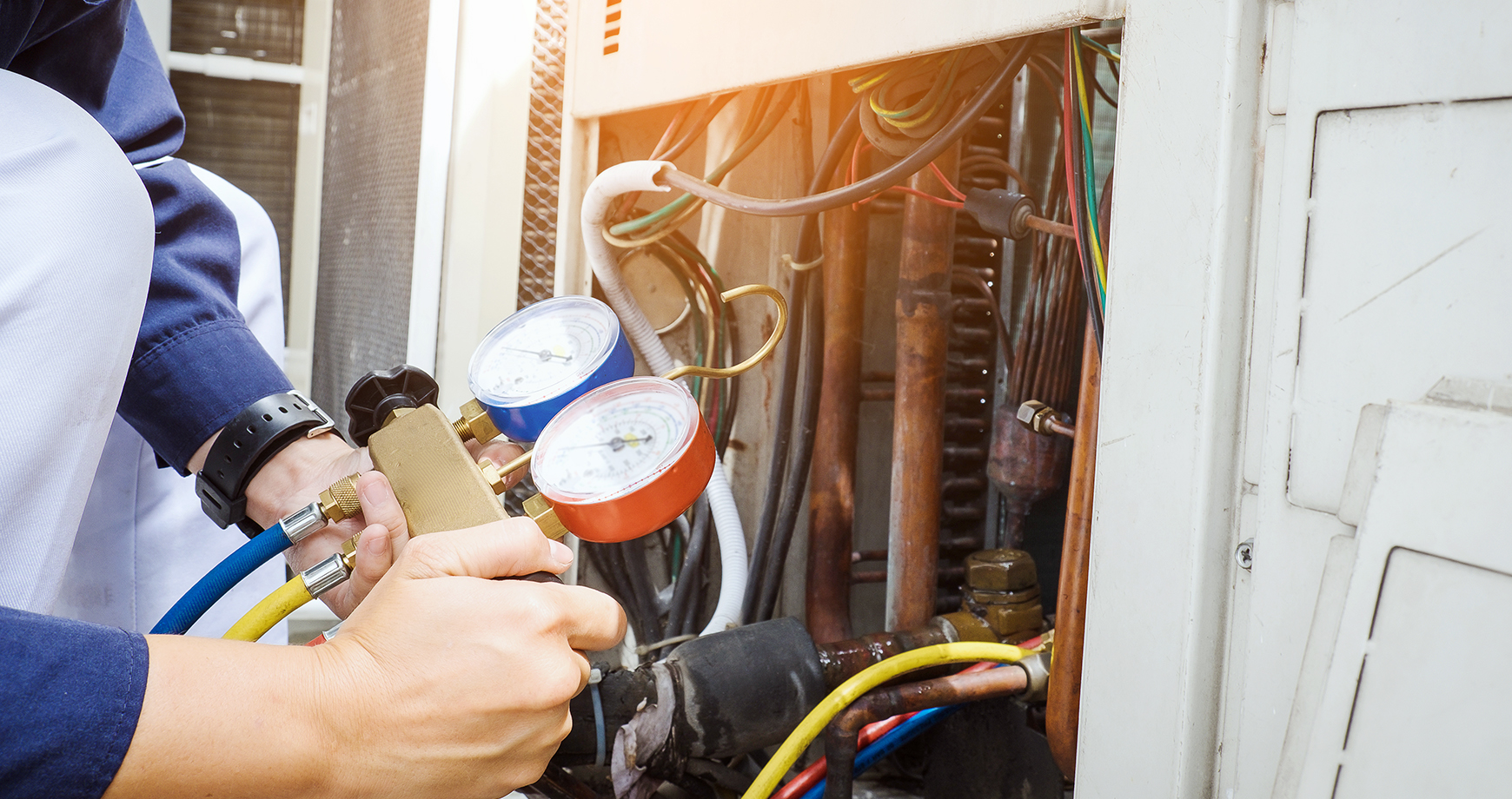 person repairing a furnace