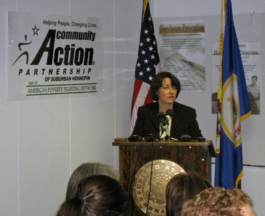 Senator Klobuchar speaks at a 2008 Housing Forum